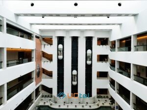 Large Building Mobile Signal Boosters for Offices and Commercial Spaces 3 Spacious corporate lobby with modern design and glass architecture
